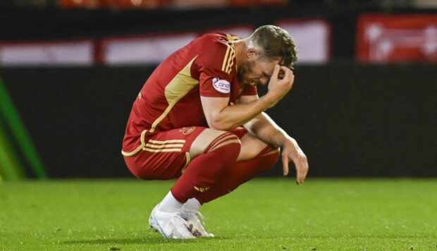 Aberdeen's Nicky Devlin looks dejected at full time of the Dons' defeat to BK Hacken.