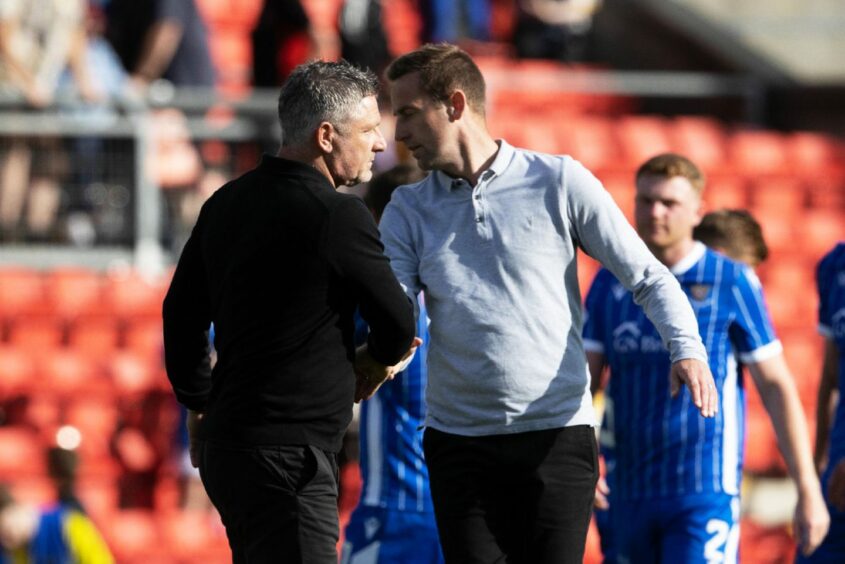 Steven MacLean with Tony Docherty at full-time. 