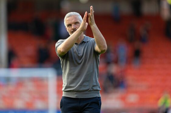 Jim Goodwin applauds Dundee United fans after his side's SPFL Trust Trophy win over Dunfermline. Image: Ross Parker/SNS