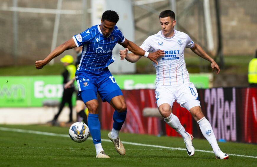 Dare Olufunwa and Tom Lawrence in action at McDiarmid Park. 