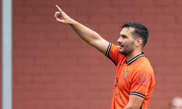 Dundee United's Tony Watt celebrates finding the net against Queen's Park
