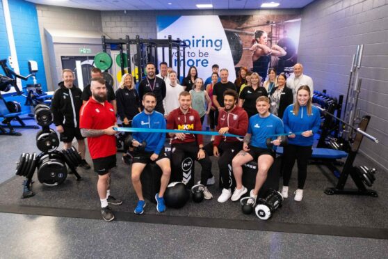 Arbroath FC players Jess Norey and Jay Bird opening the new Saltire leisure centre gym. Image: Paul Reid