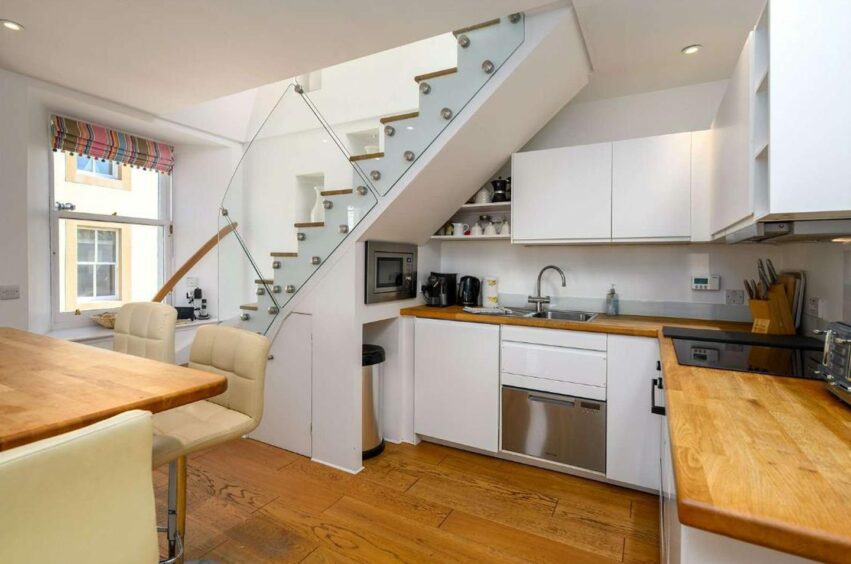 The modern kitchen at the Elie apartment with a rooftop deck 