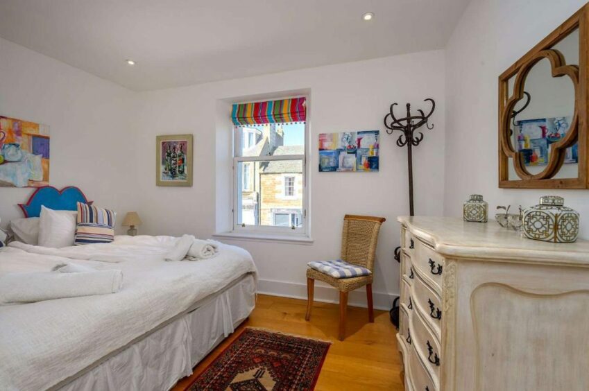 All the bedrooms feel distinctly seaside at the costal fife apartment with a rooftop decking 