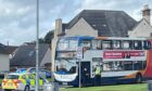 The bus in Kirkcaldy with its windows smashed after the crash