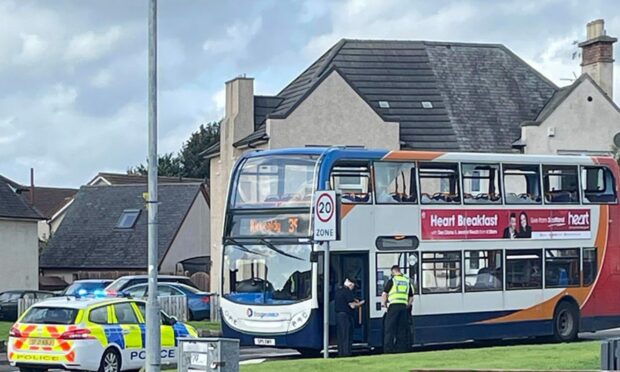 The bus in Kirkcaldy with its windows smashed after the crash