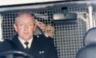 Douglas Murray McIntyre peering past the driver through the grill as he begins his sentence. Image: DC Thomson.