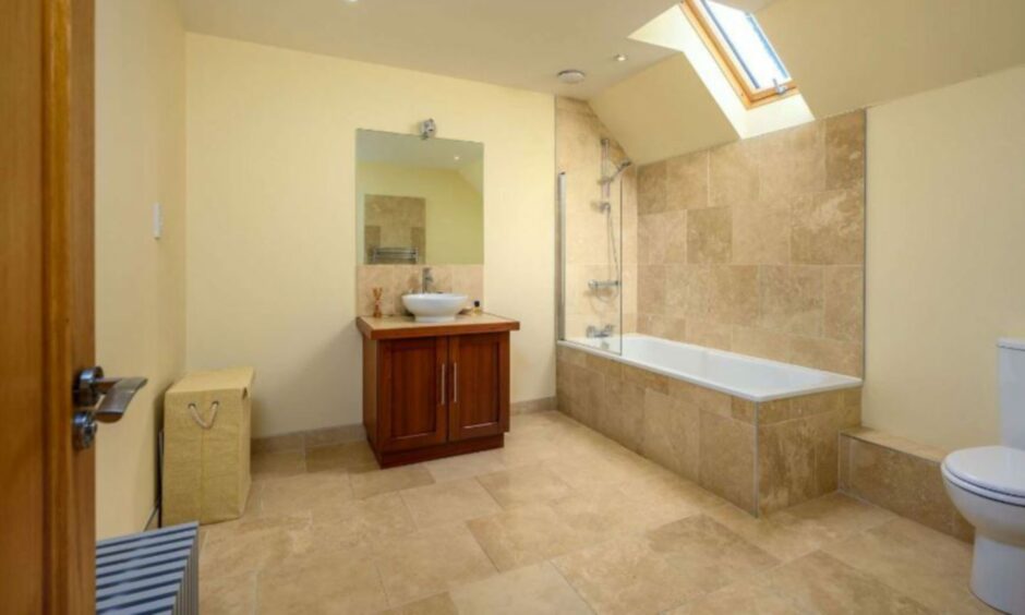 En-suite bathroom of bedroom two in Old Mill House, Errol.