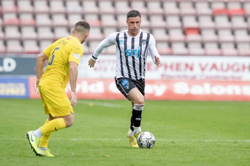 Michael O'Halloran gets on the ball to launch an attack for Dunfermline. 