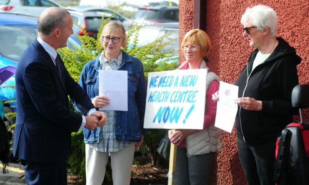 Lochgelly health centre patients staging a peaceful protest outside Lochgelly Health Centre during a visit by health secretary Michael Matheson.