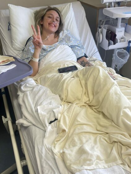 Chantelle Cox pictured in hospital after her amputation. 