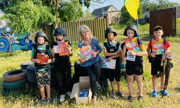 Mary-Ann gave out art supplies to a children's 'Blockpost' or military checkpoint in the Kherson region of Ukraine. Image: Mary-Ann Orr