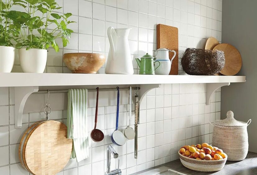 Kitchen shelving with utensils and other items.