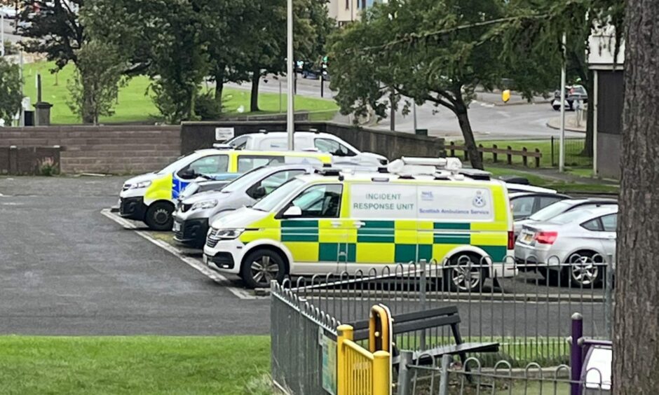 A Scottish Ambulance Service incident response unit and police at Elders Court multi in Lochee, Dundee, due to an ongoing incident