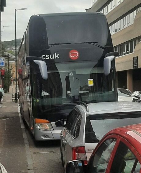 Anne-Marie's tour bus parked up in Dundee with a ticket