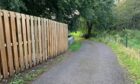 Neighbours say the fence has created a road safety hazard. Image: Angus Council