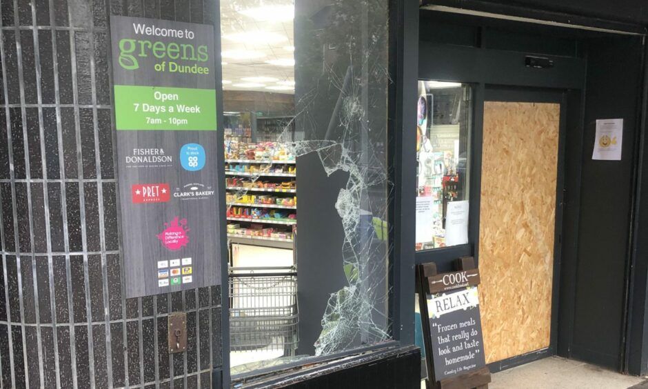 A glass panel smashed during a break-in at Greens of Dundee in Stobswell