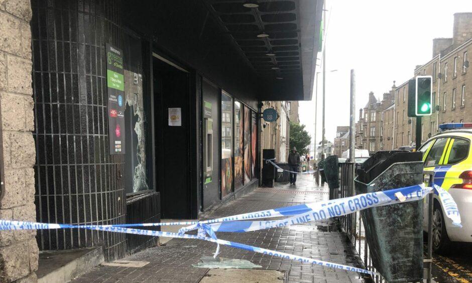 Police tape outside Greens of Dundee on Albert Street in Stobswell after the latest break-in