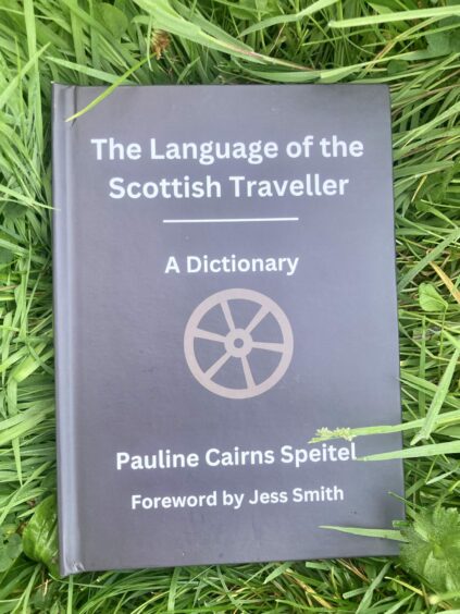 Book, with title 'The Language of the Scottish Traveller: A Dictionary, bu Pauline Cairns Speitel, Foreword by Jess Smith'.