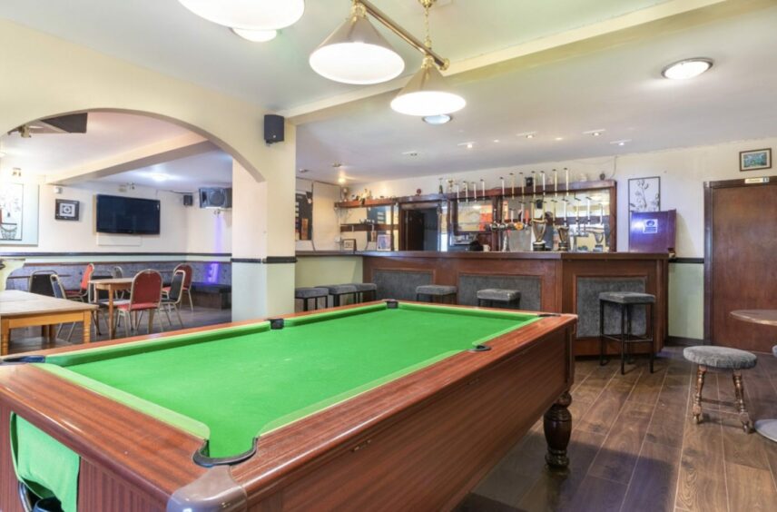 A general view of the bar area at the Park Bar in Brechin including seats and pool table