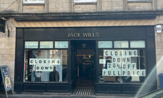 Closing-down signs on Jack Wills store in Bell Street, St Andrews.
