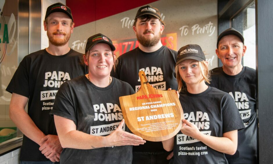 Five Papa John's staff in tshirts saying "Papa John's St Andrews - Scotland's fastest pizza-making crew!"