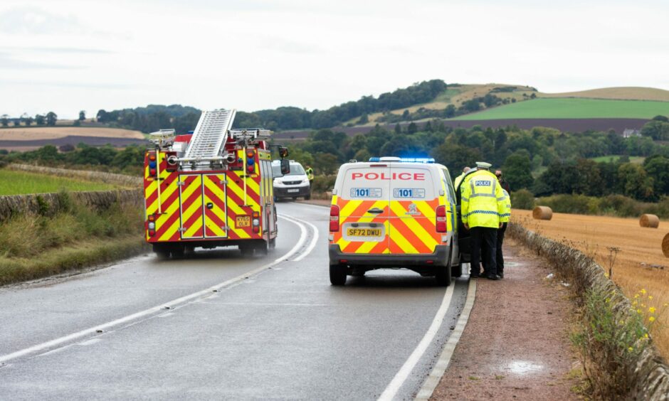 Police and firefighters at a crash on the A91 near Guardbridge