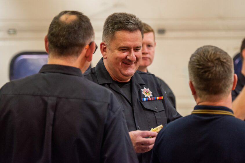 Chic Scrimgeour chats to colleagues at his retirement presentation at Blairgowrie fire station