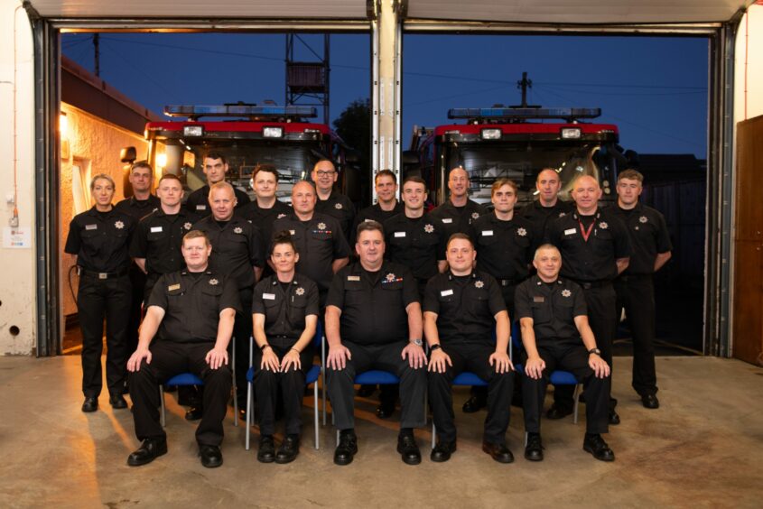 Chic Scrimgeour, seated centre, with the Blairgowrie firefighters at the fire station.