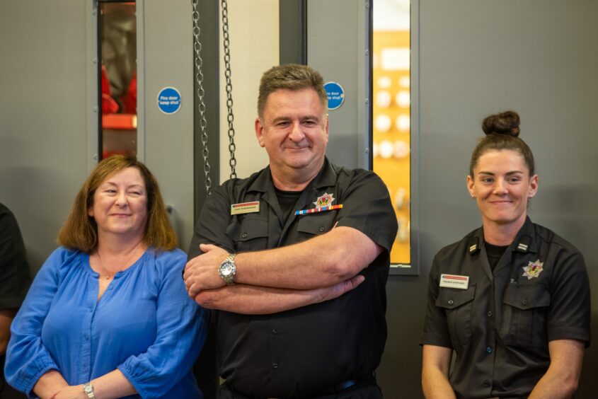 Jackie and Chic Scrimgeour and Crew Commander Frankie Shepherd at Blairgowrie fire station