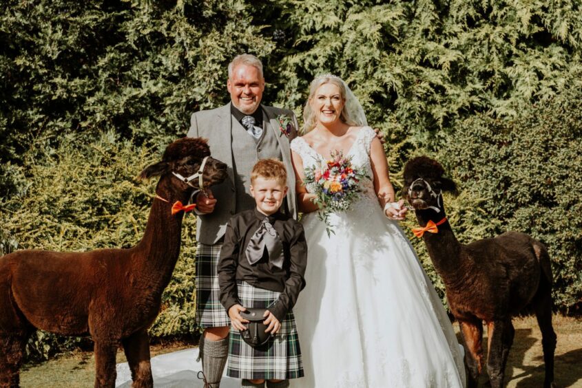 Kimberly Adams and Iain Gordon with son Rory at their wedding in Fife