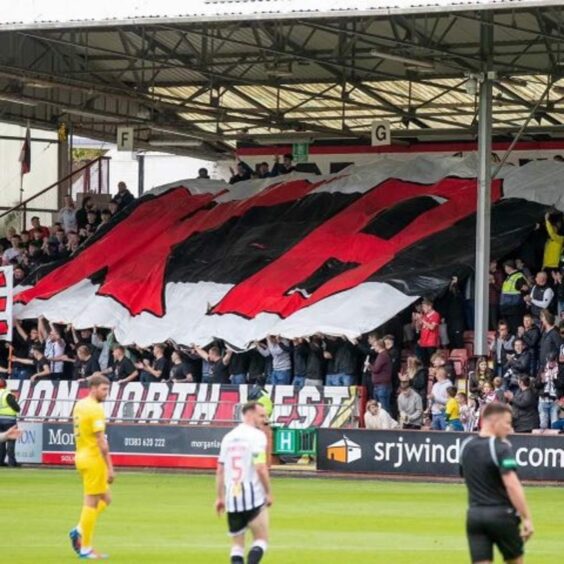 Dunfermline Athletic fans unfurled a huge banner inscribed with Kray Bathgate's initials.