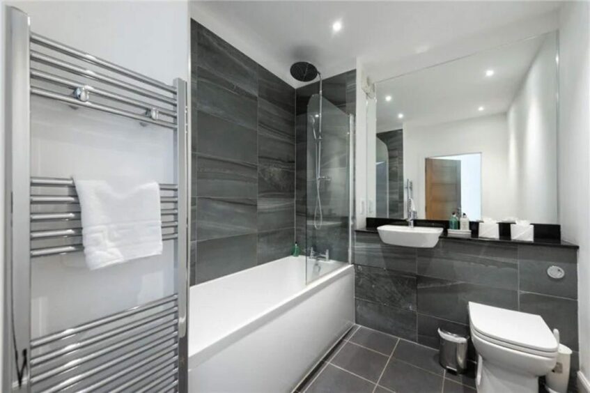 The modern bathroom with deluge shower head at Taymouth Marina flat 