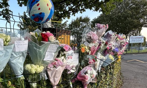 Floral tributes outside Inverkeithing High School following the death of a pupil in September.