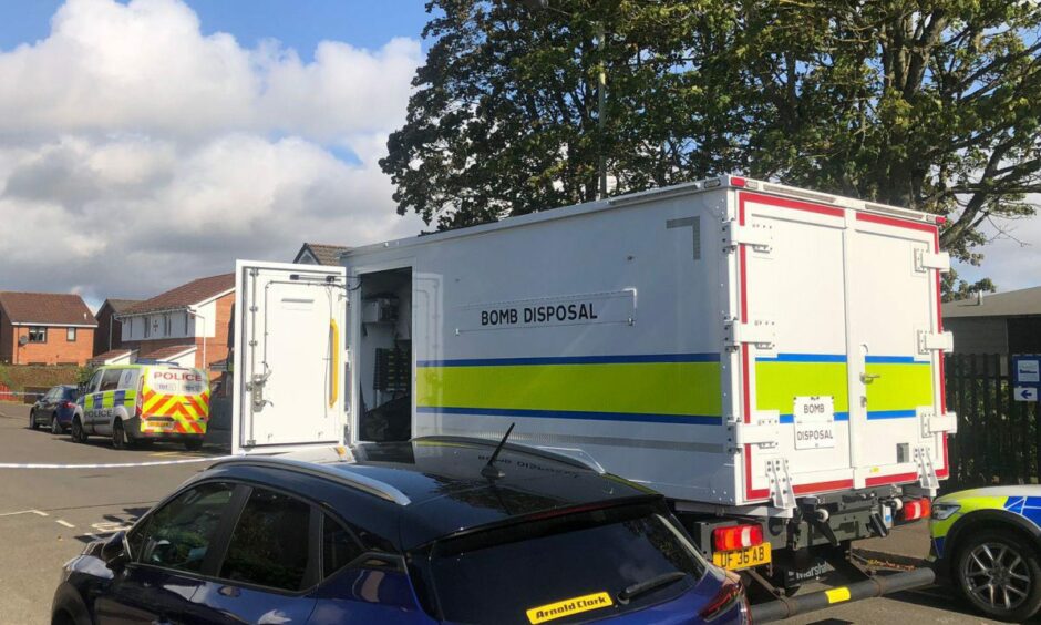 A bomb disposal unit and police on Ambleside Avenue in Kirkton, Dundee