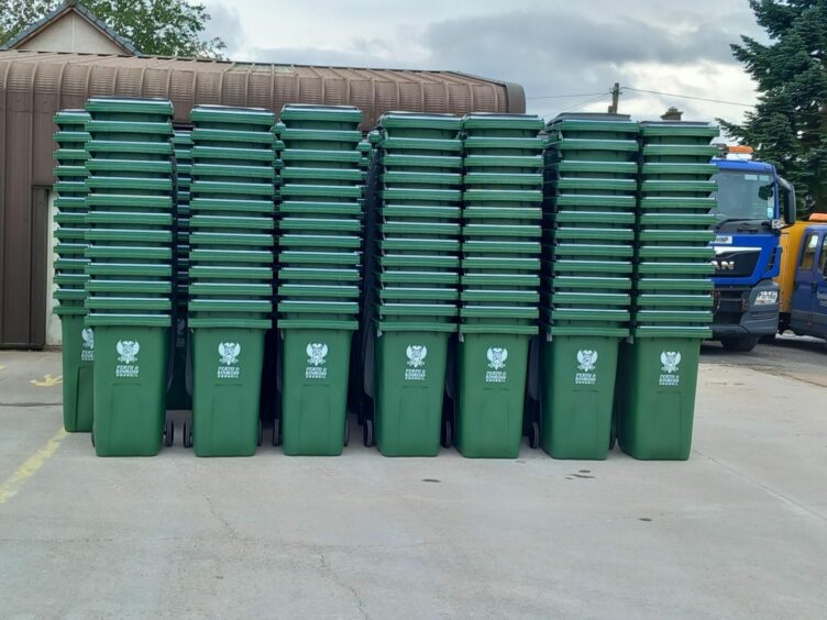 Dozens of Perth and Kinross Council bins piled up in rows