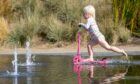 Annie Russell, 3, from Broughty Ferry enjoys the warm weather at Dundee Waterfront splash pad