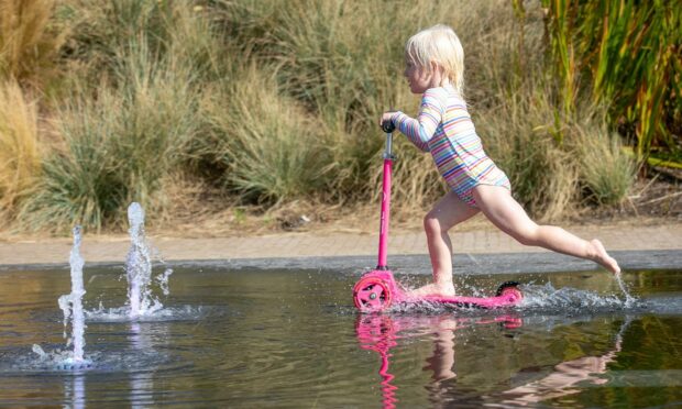 Annie Russell, 3, from Broughty Ferry enjoys the warm weather at Dundee Waterfront splash pad