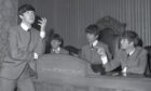 The Beatles playing it for laughs in the Council Chambers in Dundee's City Square in 1963. Image: DC Thomson.
