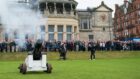 New R&A captain Neil Donaldson tees off to the sound of a cannon firing