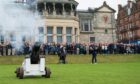 New R&A captain Neil Donaldson tees off to the sound of a cannon firing