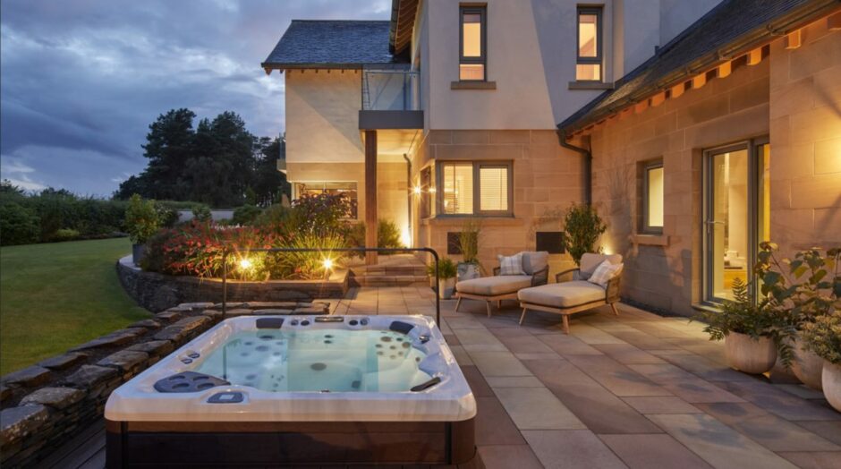 The outdoor terrace and hot tub at the Gleneagles house, which is top prize in the Omaze Scotland draw