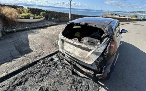 The wreckage of one of the vehicles destroyed in the blaze at Kinghorn.