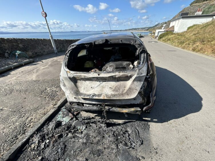 One of the burnt out cars close to Pettycur Beach in Kinghorn.
