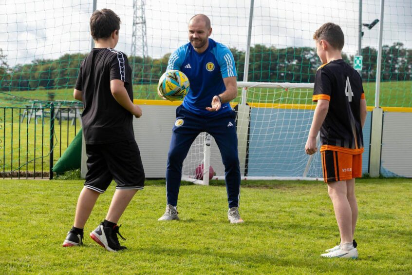 Robbie Neilson helps Seamab launch its first-ever football team. Image: Seamab.