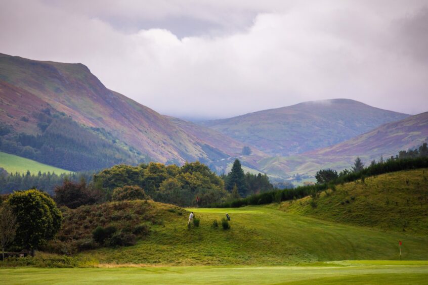 Golf course, with hills around Auchterarder in distance