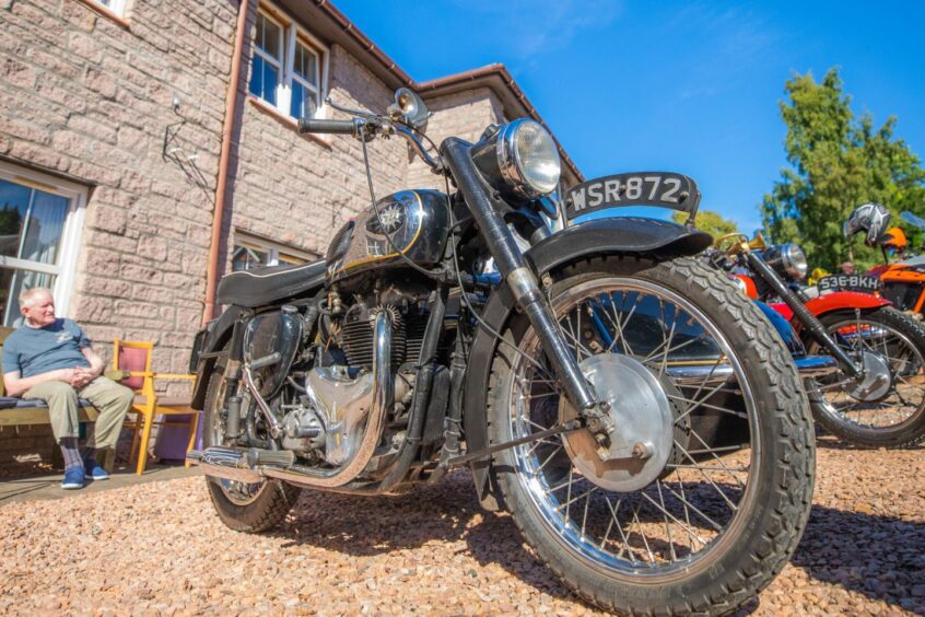 Close up of black BSA Golden Flame motorbike which one belonged to Grant Miller's grandfather.