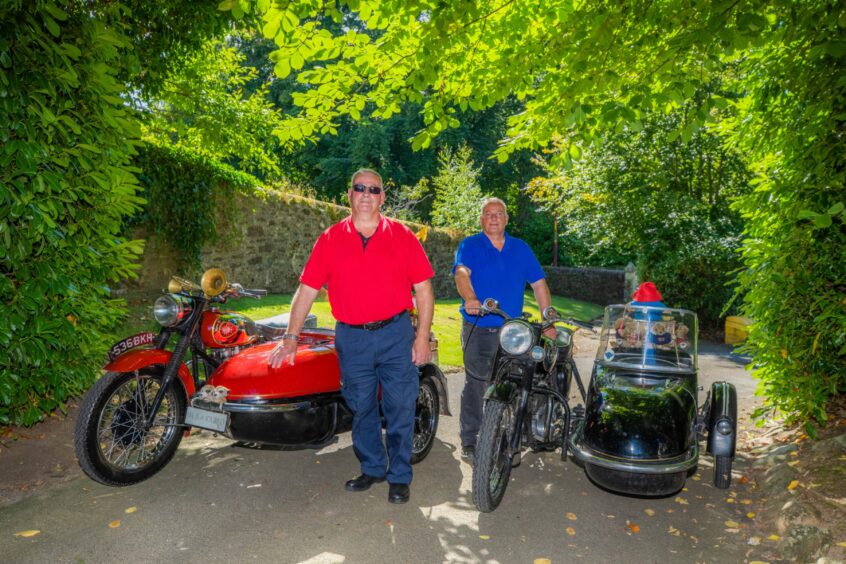 Fraser and Grant Miller standing next to their matching motorbikes with sidecars in Crieff