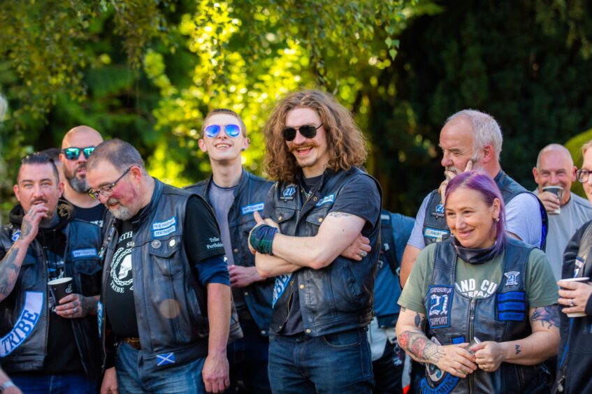 Bikers smiling and laughing in the grounds of the Birches care home, Crieff.