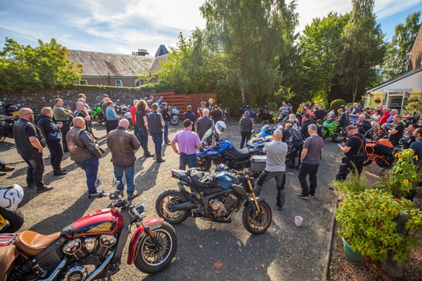 Large group of bikers in grounds of the Birches care home, Crieff.